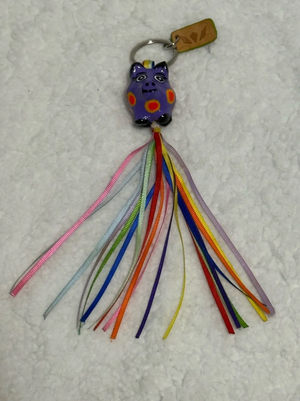 Consuela Purple Piggicito Tassel Keychain Charm with Colorful Ribbons - Picture 1 of 2